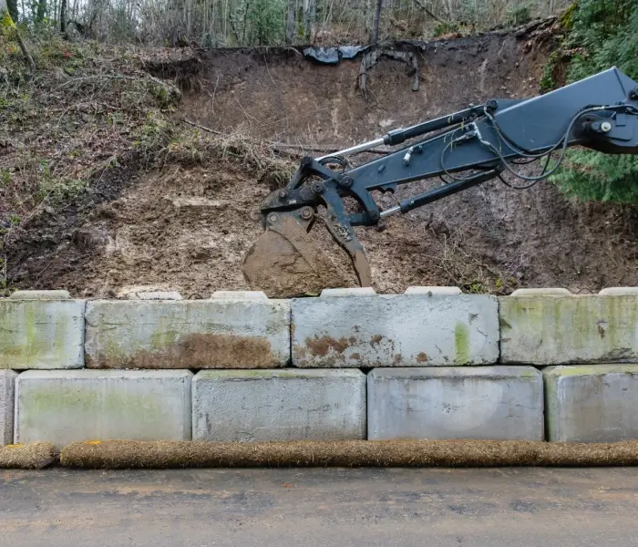Concrete barriers placed at slope base
